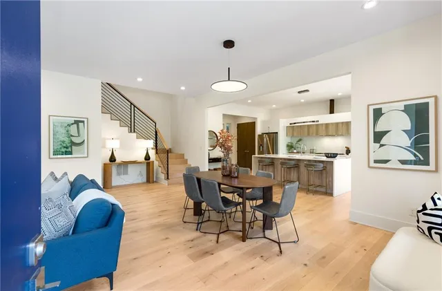 a view of a livingroom with furniture and a flat screen tv