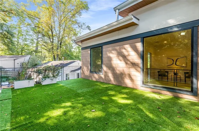 a view of an empty room and wooden floor