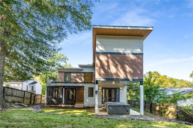 a view of a patio with table and chairs under an umbrella