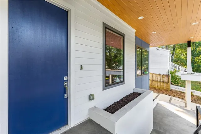 a front view of a house with a yard table and chairs