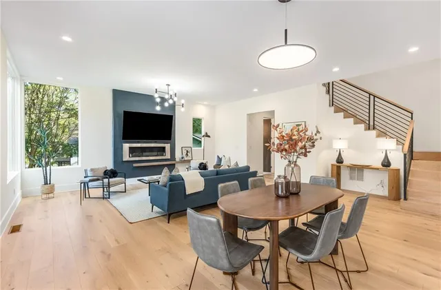 a view of a dining room with furniture window and wooden floor