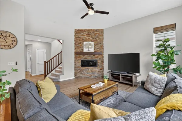 a living room with furniture and a flat screen tv