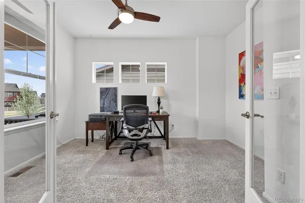 a view of a livingroom with furniture and a window