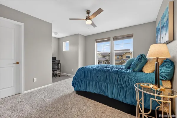 a bedroom with a bed dresser and a window