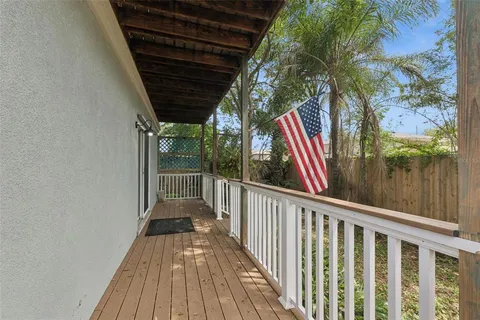 a view of balcony with wooden floor