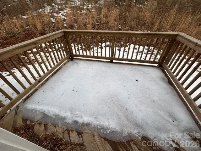 a view of balcony with wooden floor