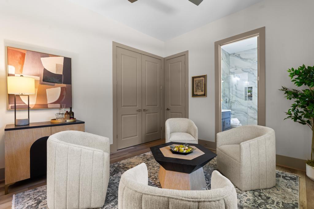 4611 Medlock Bridge Road Peachtree Corners, GA 30097 - Photo 13 of 36 a living room with furniture and a potted plant