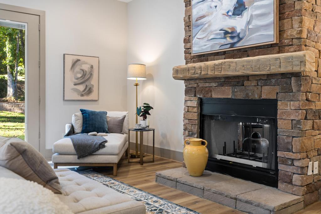 4611 Medlock Bridge Road Peachtree Corners, GA 30097 - Photo 16 of 36 a living room with furniture and a fireplace