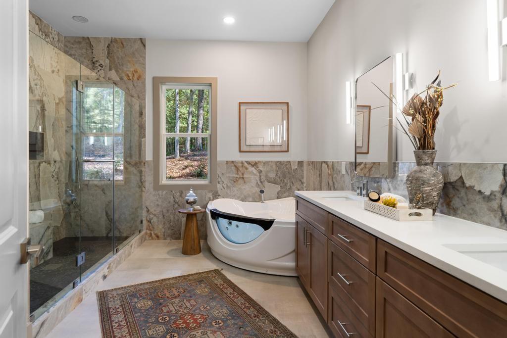 4611 Medlock Bridge Road Peachtree Corners, GA 30097 - Photo 17 of 36 a bathroom with a sink and a mirror