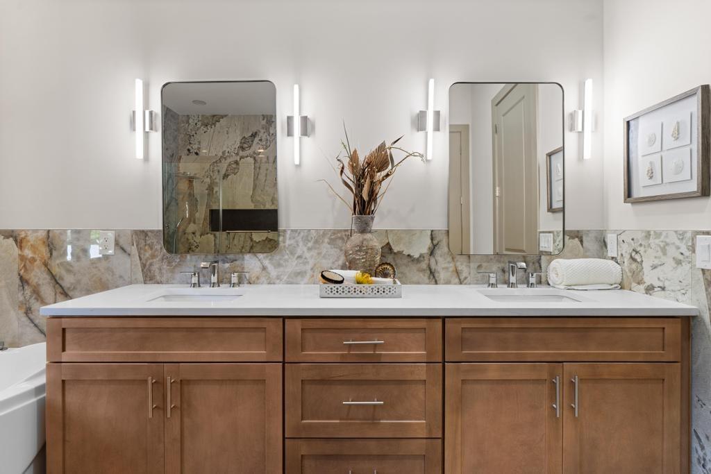 4611 Medlock Bridge Road Peachtree Corners, GA 30097 - Photo 18 of 36 a bathroom with a sink and a mirror