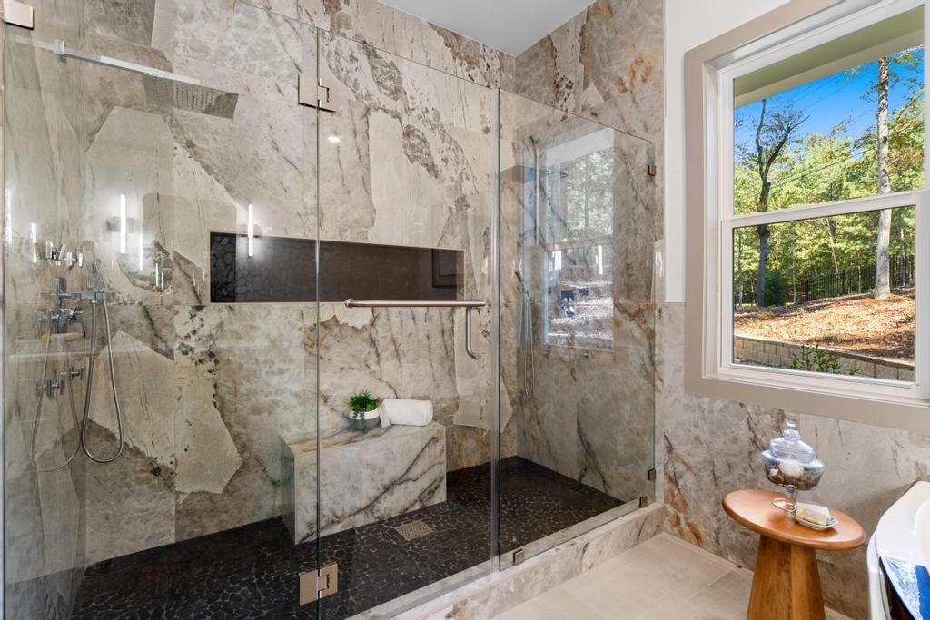 4611 Medlock Bridge Road Peachtree Corners, GA 30097 - Photo 19 of 36 a bathroom with a sink and shower