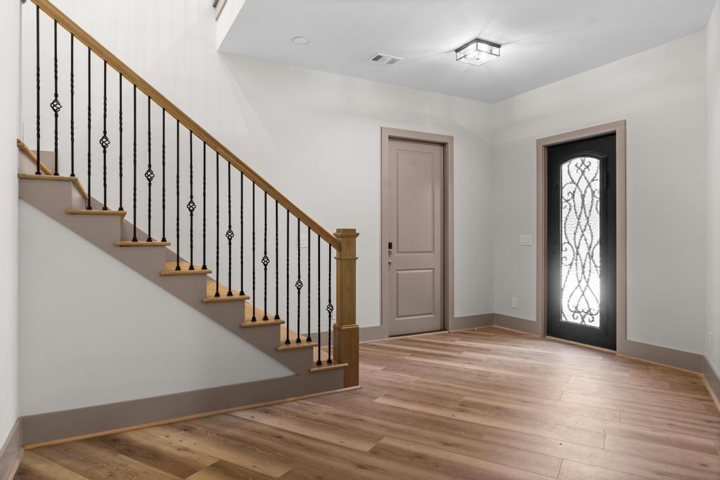 4611 Medlock Bridge Road Peachtree Corners, GA 30097 - Photo 24 of 36 a view of a hallway with wooden floor and stairs