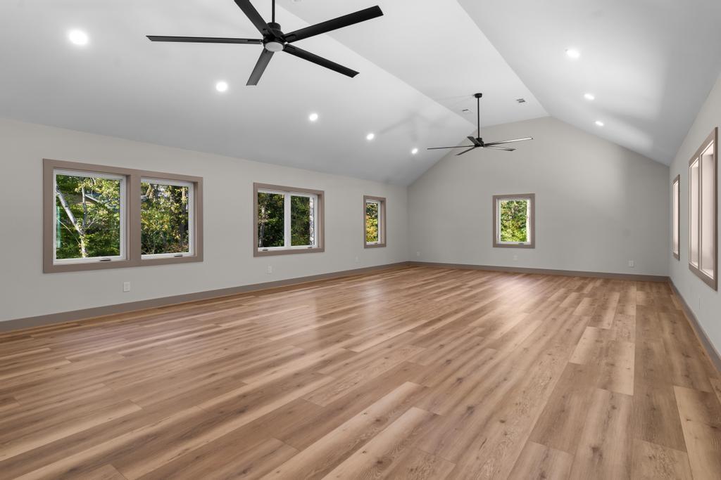 4611 Medlock Bridge Road Peachtree Corners, GA 30097 - Photo 26 of 36 a view of an empty room with a window and wooden floor