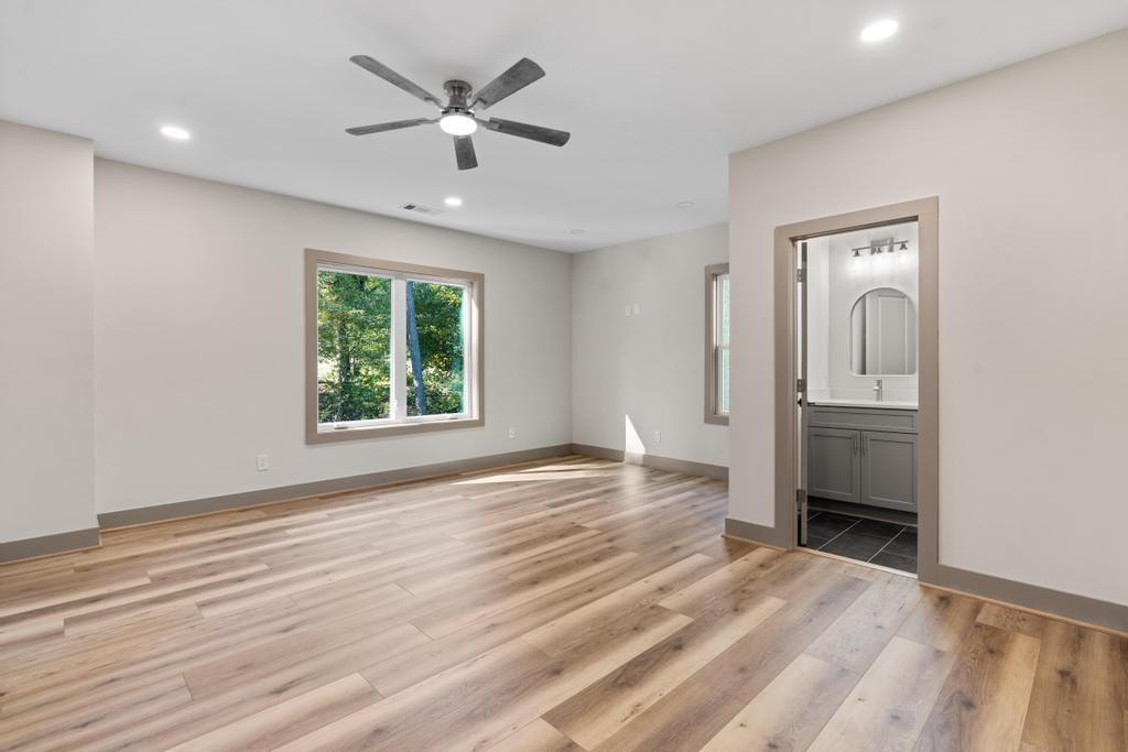 4611 Medlock Bridge Road Peachtree Corners, GA 30097 - Photo 28 of 36 wooden floor in an empty room with a window