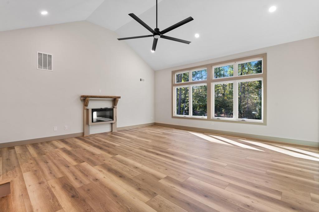 4611 Medlock Bridge Road Peachtree Corners, GA 30097 - Photo 29 of 36 a view of an empty room with a window and a kitchen