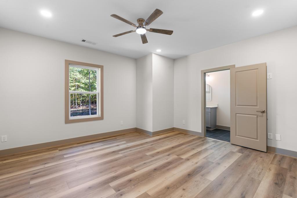 4611 Medlock Bridge Road Peachtree Corners, GA 30097 - Photo 30 of 36 wooden floor in an empty room with a window
