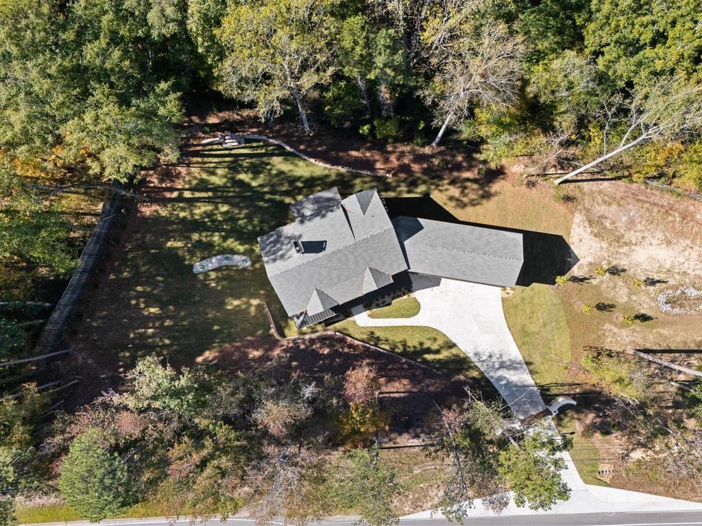 4611 Medlock Bridge Road Peachtree Corners, GA 30097 - Photo 33 of 36 a view of a house with a yard