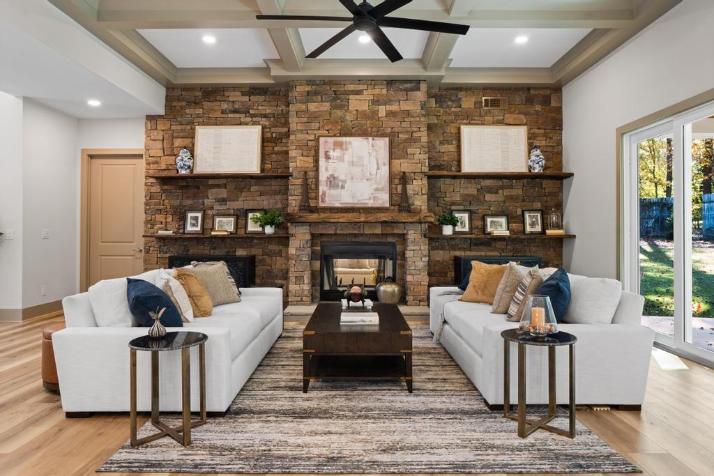 4611 Medlock Bridge Road Peachtree Corners, GA 30097 - Photo 5 of 36 a living room with fireplace furniture and a flat screen tv