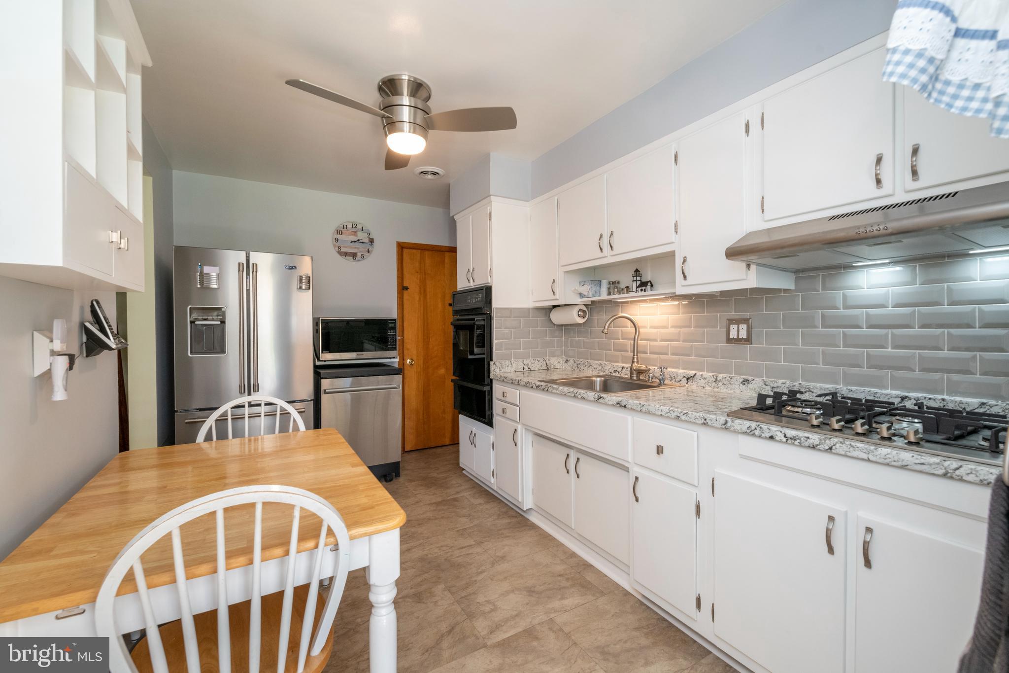 8209 Old Philadelphia Road Rosedale, MD 21237 - Photo 13 of 35 Kitchen with table space, ceiling fan & ss appl