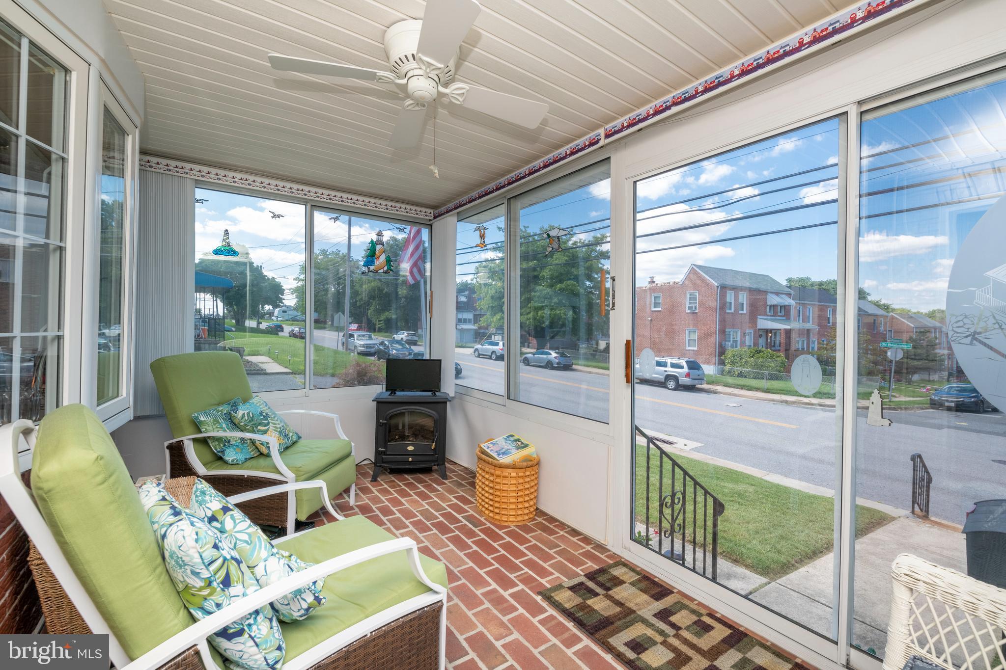 8209 Old Philadelphia Road Rosedale, MD 21237 - Photo 4 of 35 Porch has ceiling fan and brick floor