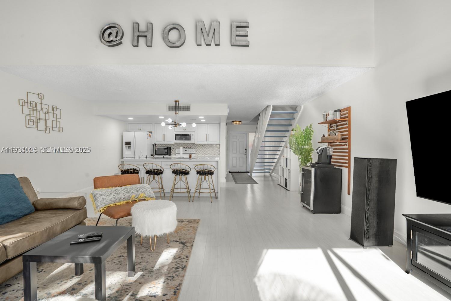 1281 West Fairway Road Pembroke Pines, FL 33026 - Photo 21 of 29 a living room with furniture and a flat screen tv