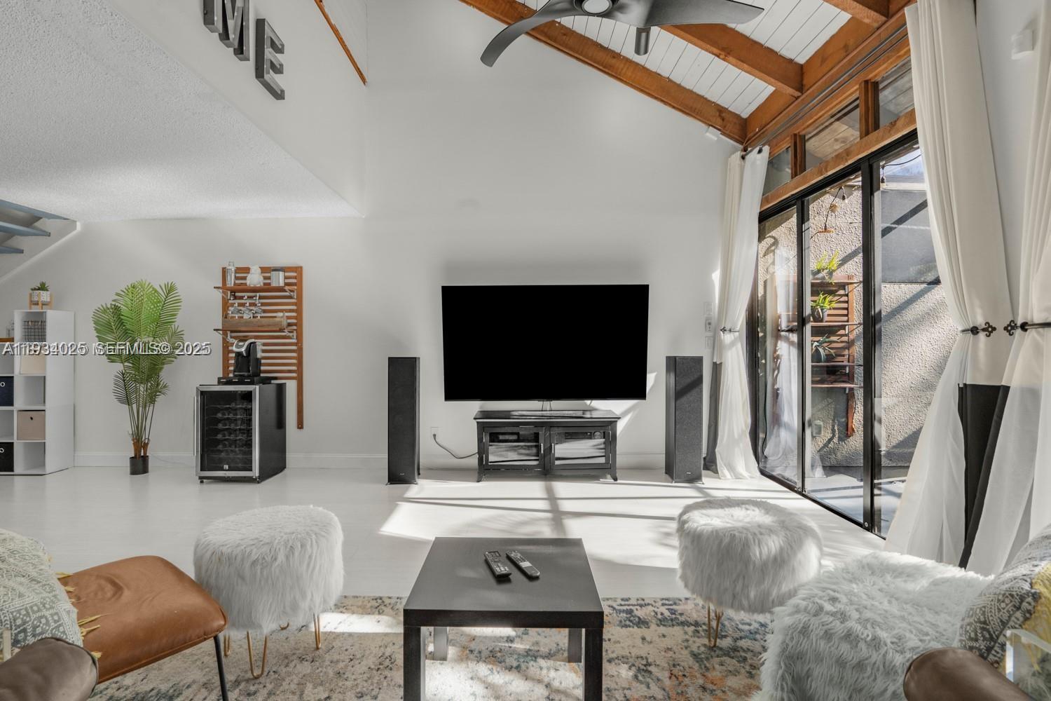 1281 West Fairway Road Pembroke Pines, FL 33026 - Photo 22 of 29 a living room with furniture and a flat screen tv