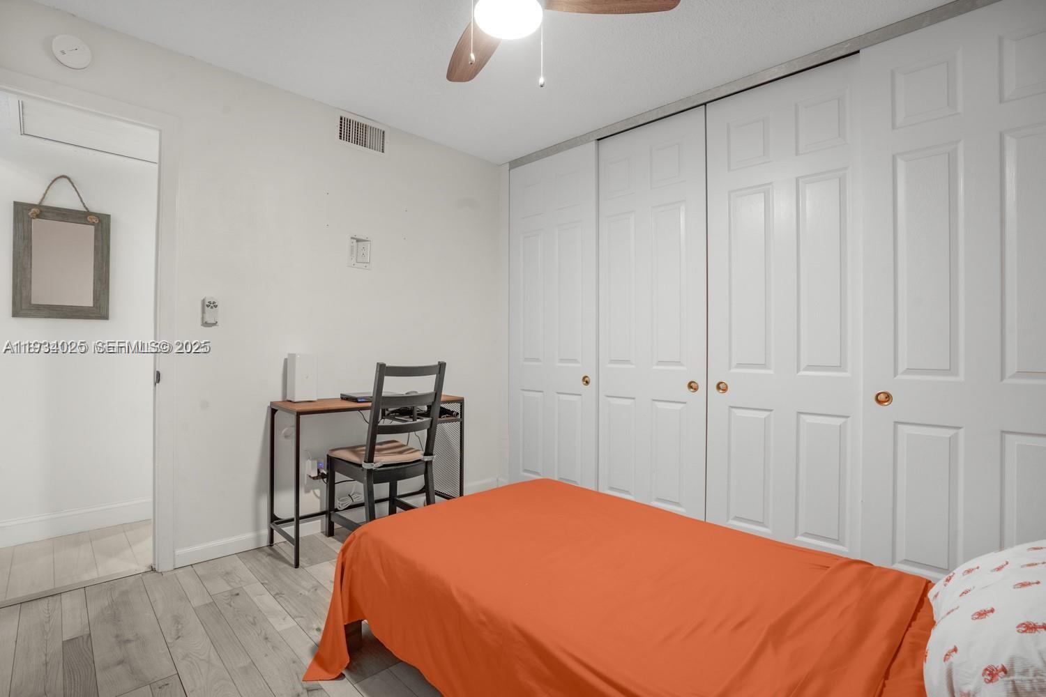 1281 West Fairway Road Pembroke Pines, FL 33026 - Photo 27 of 29 a bedroom with a bed and a table in it