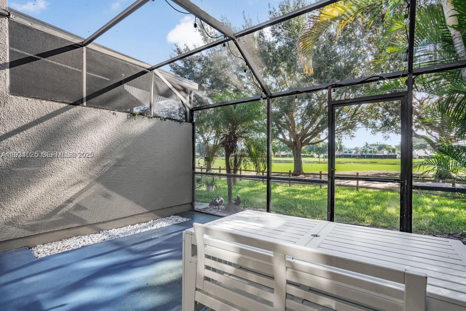 1281 West Fairway Road Pembroke Pines, FL 33026 - Photo 29 of 29 a view of a wooden deck and a yard