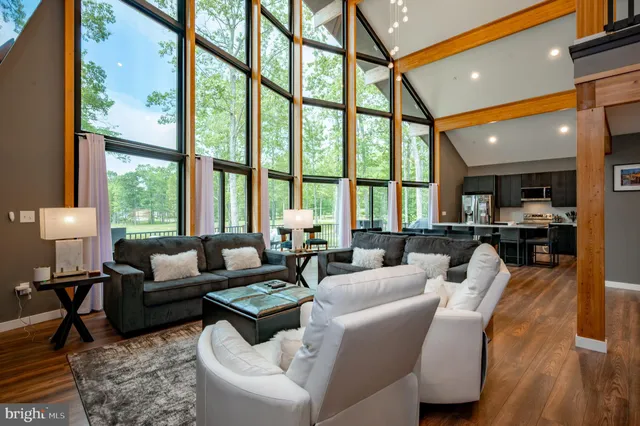 a bedroom with a bed and a lamp on the dresser