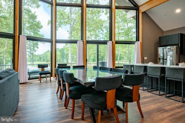 a bedroom with a bed and a large mirror