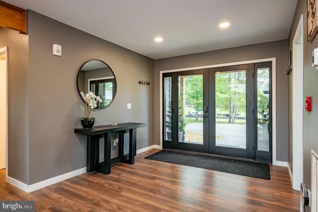 a bedroom with a large bed and a large window