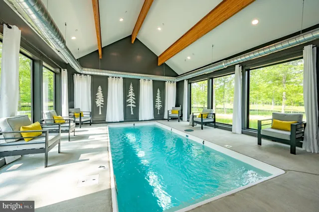 a living room with furniture ceiling fan and a rug