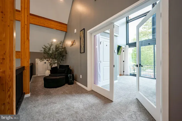 a bathroom with a sink a mirror a vanity and a shower