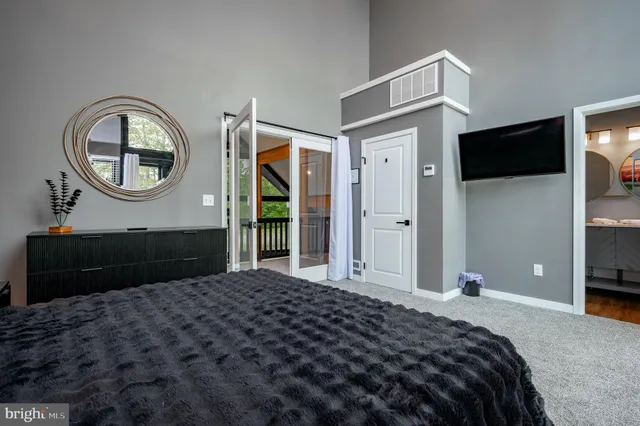 a bedroom with a bed and a closet