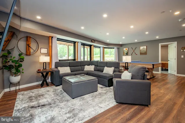 a view of a house with backyard porch and sitting area