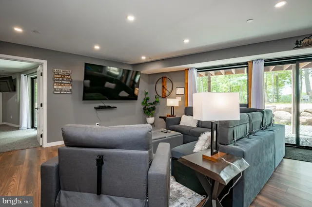 a view of a house with a yard balcony and furniture