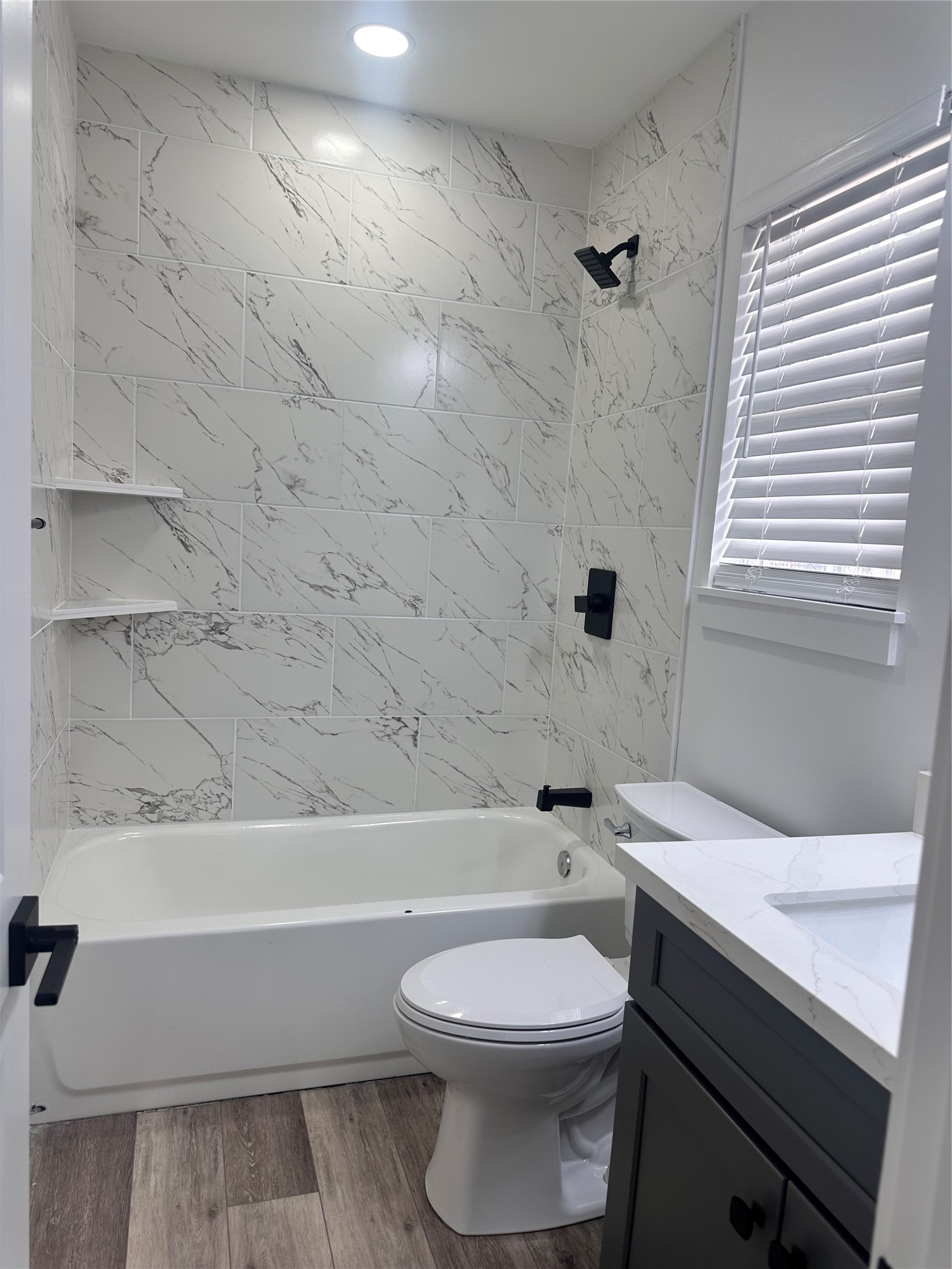 5420 Aldine Bender Road Houston, TX 77032 - Photo 13 of 13 a bathroom with a sink a toilet and bathtub