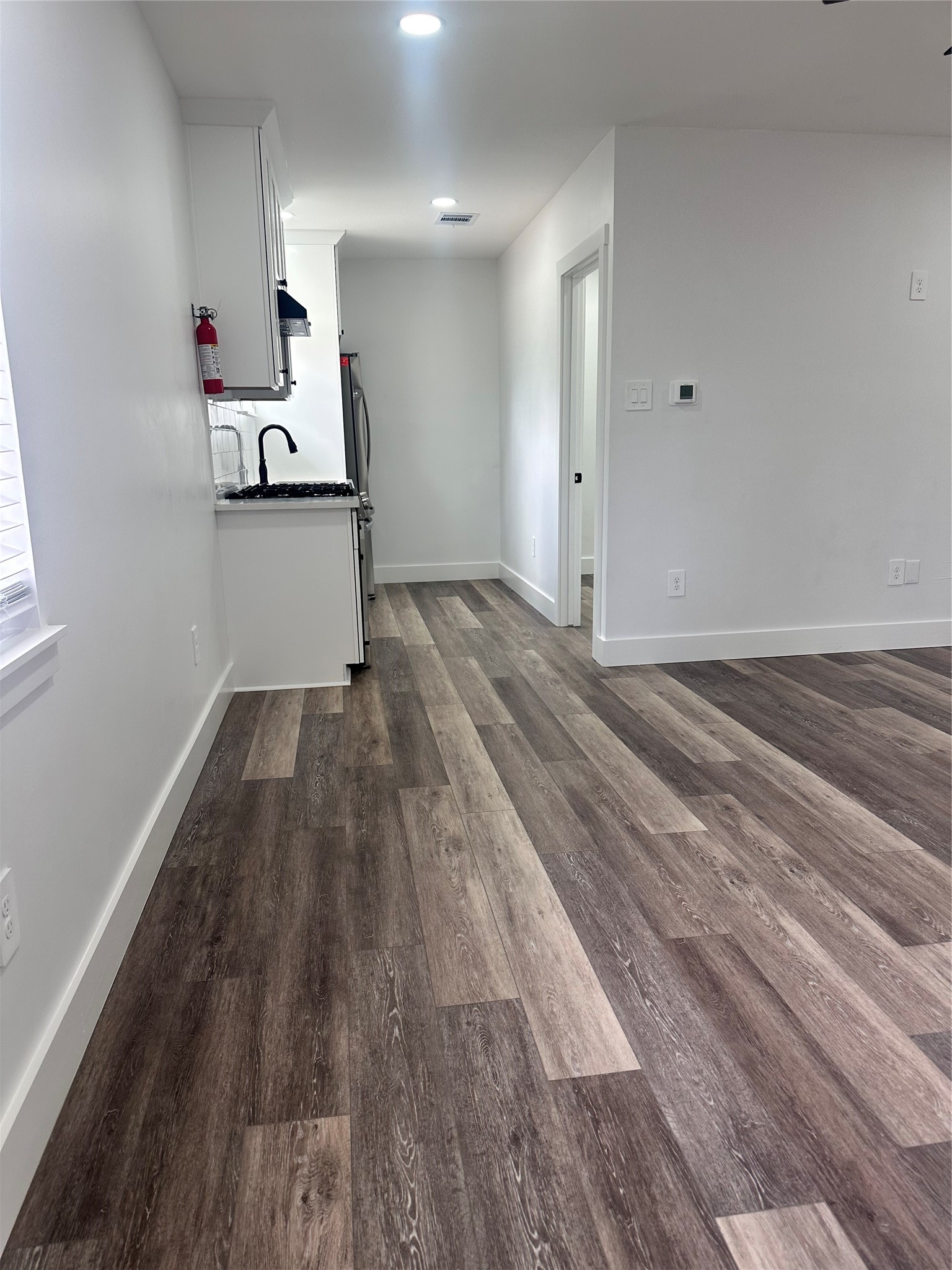 5420 Aldine Bender Road Houston, TX 77032 - Photo 2 of 13 a view of empty room with wooden floor