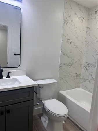 a bathroom with a sink toilet and a bathtub