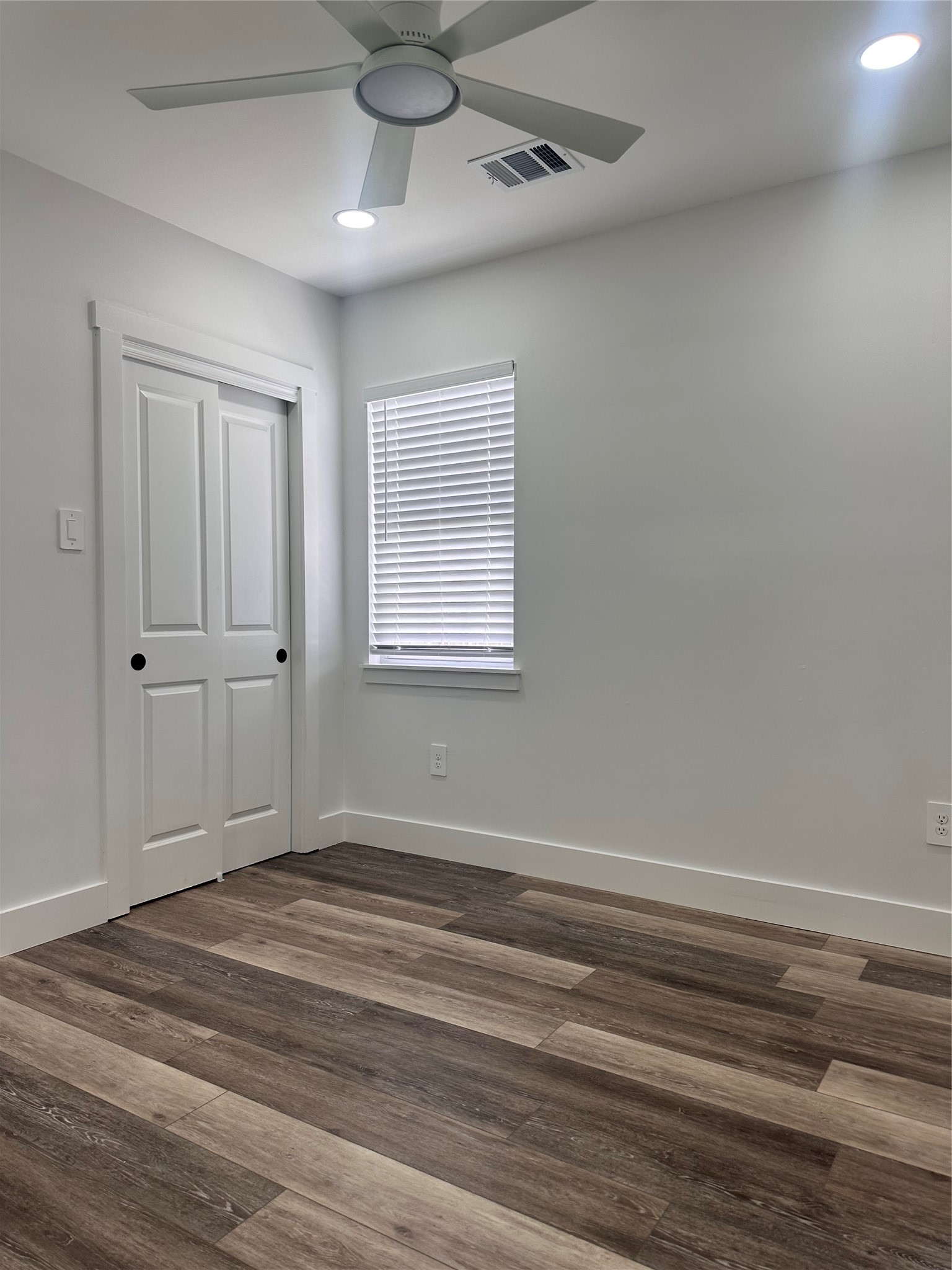 5420 Aldine Bender Road Houston, TX 77032 - Photo 9 of 13 a view of empty room with wooden floor and fan