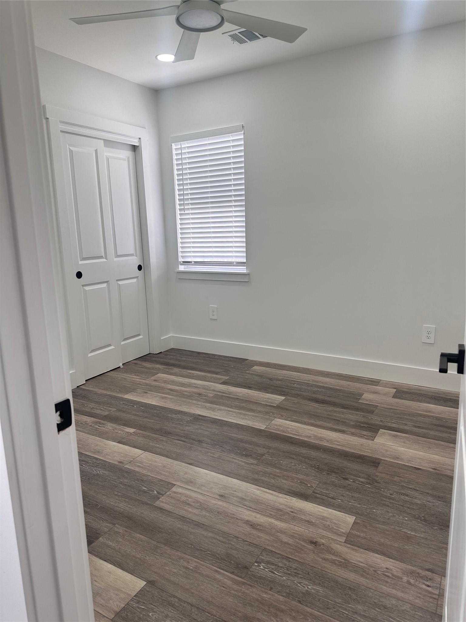 5420 Aldine Bender Road Houston, TX 77032 - Photo 10 of 13 a bathroom with a window and a chandelier fan