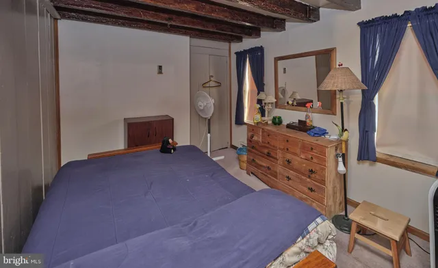 a bed room with a bed and a dresser