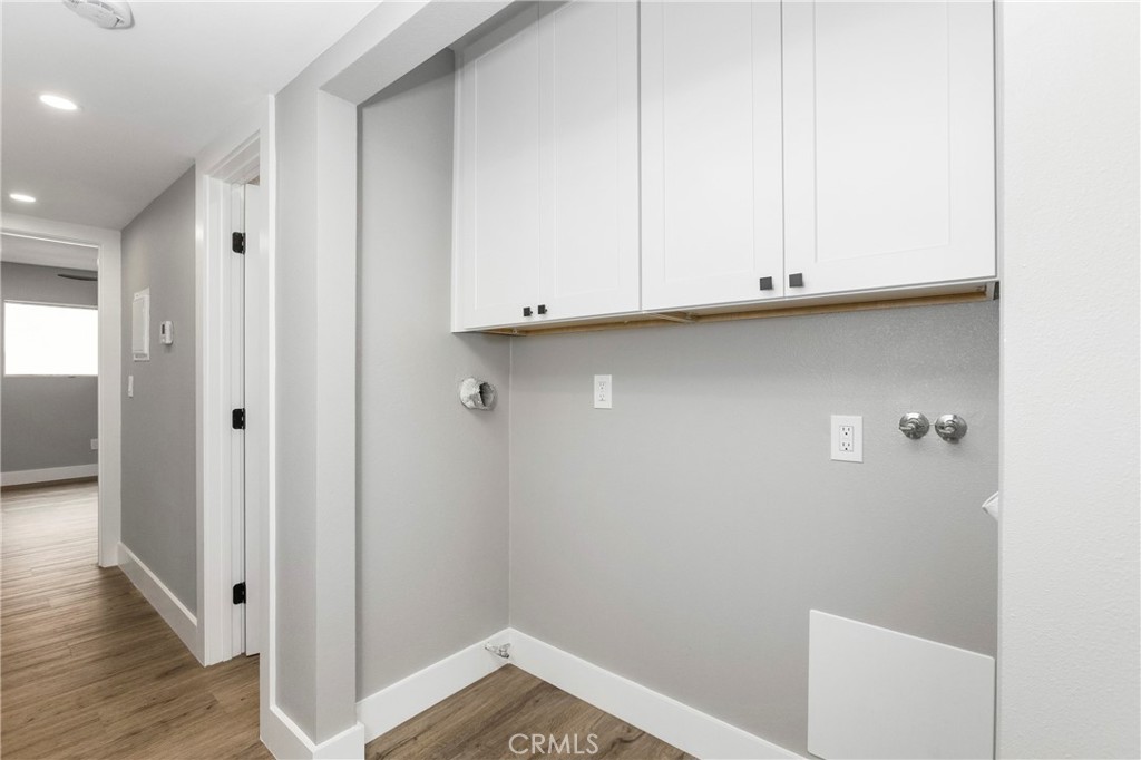 31377 Los Rios Street, Unit 64F San Juan Capistrano, CA 92675 - Photo 12 of 61 a view of storage and utility room with wooden floor