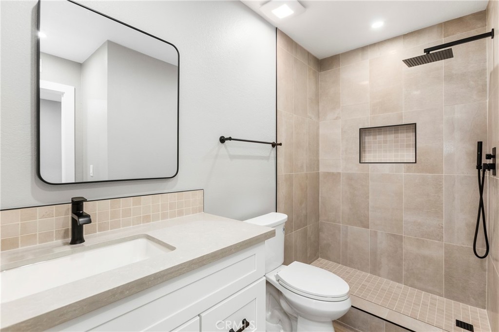 31377 Los Rios Street, Unit 64F San Juan Capistrano, CA 92675 - Photo 23 of 61 a bathroom with a sink a toilet and shower