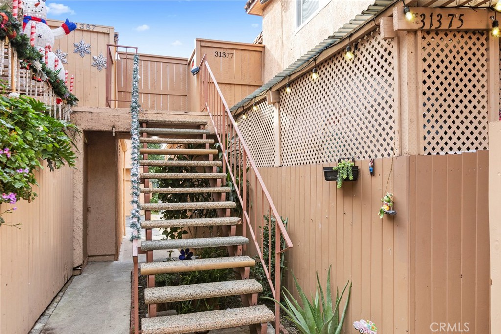31377 Los Rios Street, Unit 64F San Juan Capistrano, CA 92675 - Photo 29 of 61 a view of entryway with wooden floor and front door
