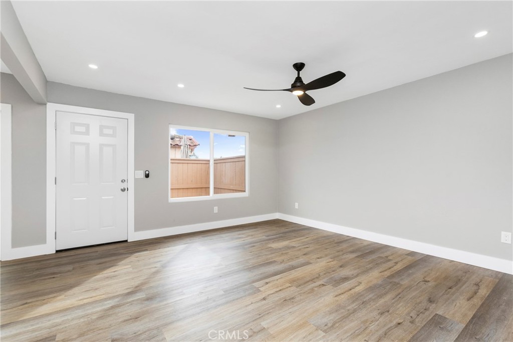 31377 Los Rios Street, Unit 64F San Juan Capistrano, CA 92675 - Photo 4 of 61 a view of an empty room with window and wooden floor