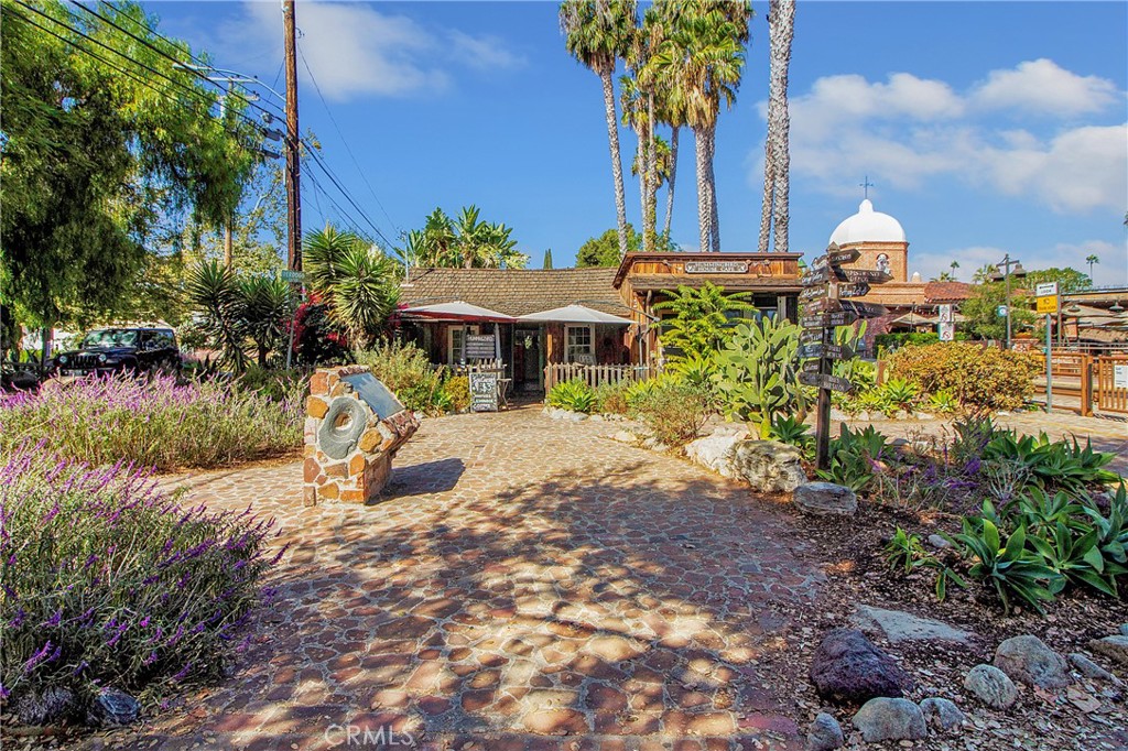31377 Los Rios Street, Unit 64F San Juan Capistrano, CA 92675 - Photo 47 of 61 a view of a house with a yard and sitting area