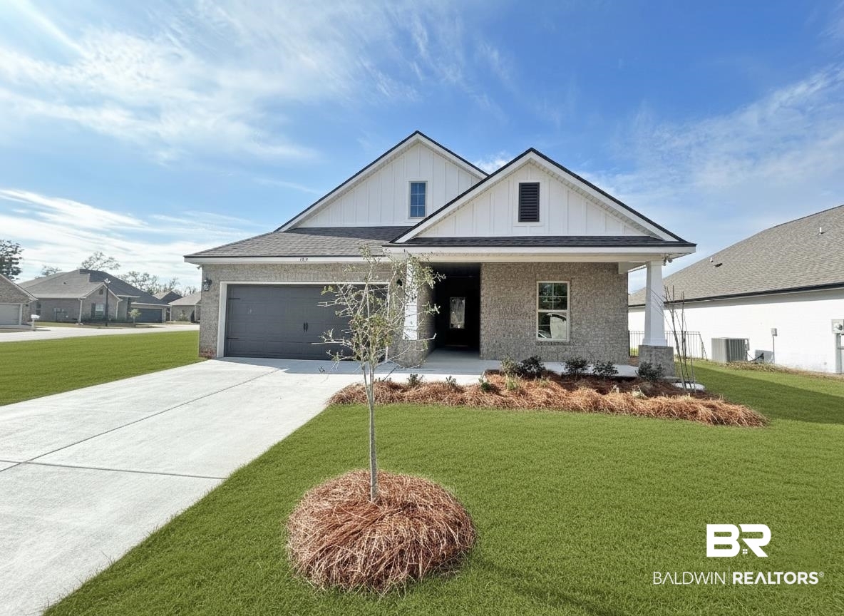 825 Sumter Loop Foley, AL 36535 - Photo 1 of 21 Modern inspired farmhouse with board and batten siding, a porch, a front yard, brick siding, and driveway