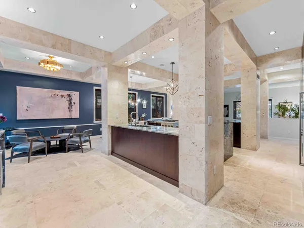an open kitchen and dining room with furniture