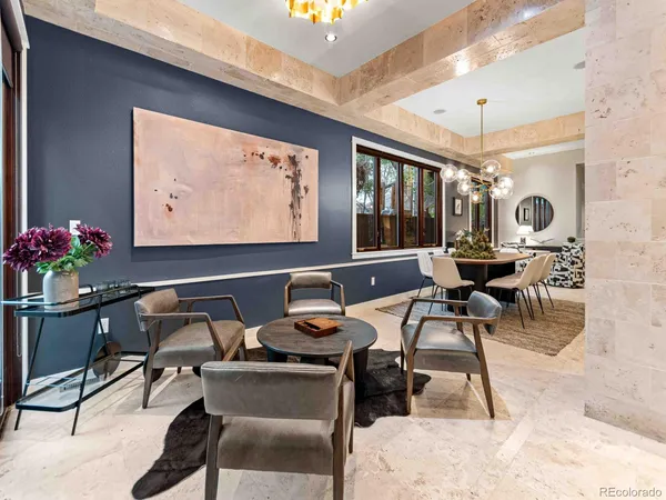a large kitchen with a table and chairs